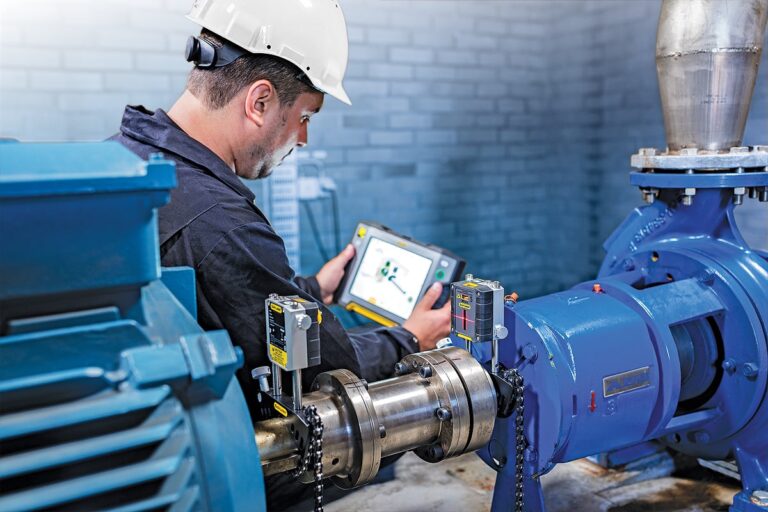 A Fulton team member reviewing a schematic of boiler components for alignment