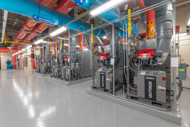 Several Fulton Vantage boilers installed in a clean sub-basement of a commercial facility